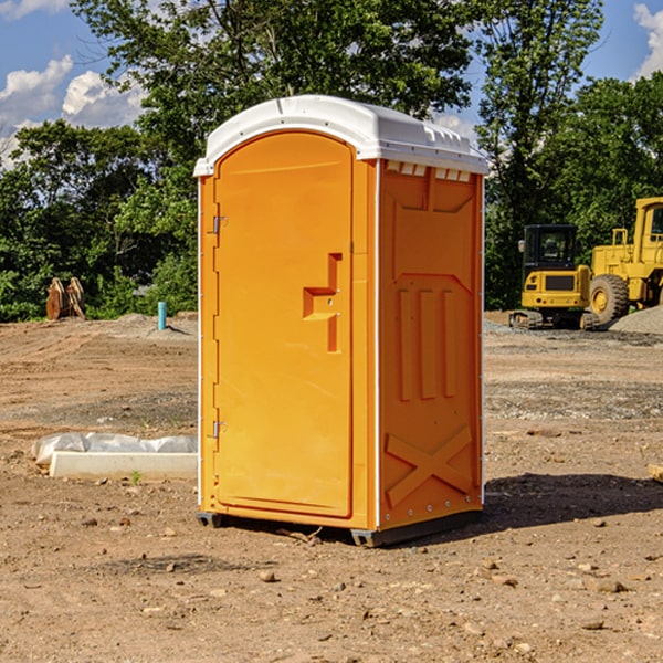 how often are the portable restrooms cleaned and serviced during a rental period in Lane